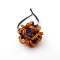 Handmade chainmail mini Halloween ornament, pumpkin orange, black, and purple seasonal dodecahedron decoration