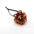 Handmade chainmail mini Halloween ornament, pumpkin orange, black, and purple seasonal dodecahedron decoration