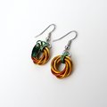 Small pumpkin earrings, fall jewelry with green leaf accent, handmade chainmail swirled knot -autumn, Halloween and Thanksgiving accessories