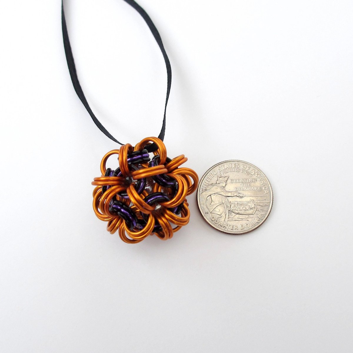 Handmade chainmail mini Halloween ornament, pumpkin orange, black, and purple seasonal dodecahedron decoration