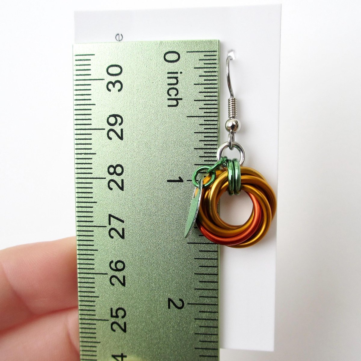 Small pumpkin earrings, fall jewelry with green leaf accent, handmade chainmail swirled knot -autumn, Halloween and Thanksgiving accessories