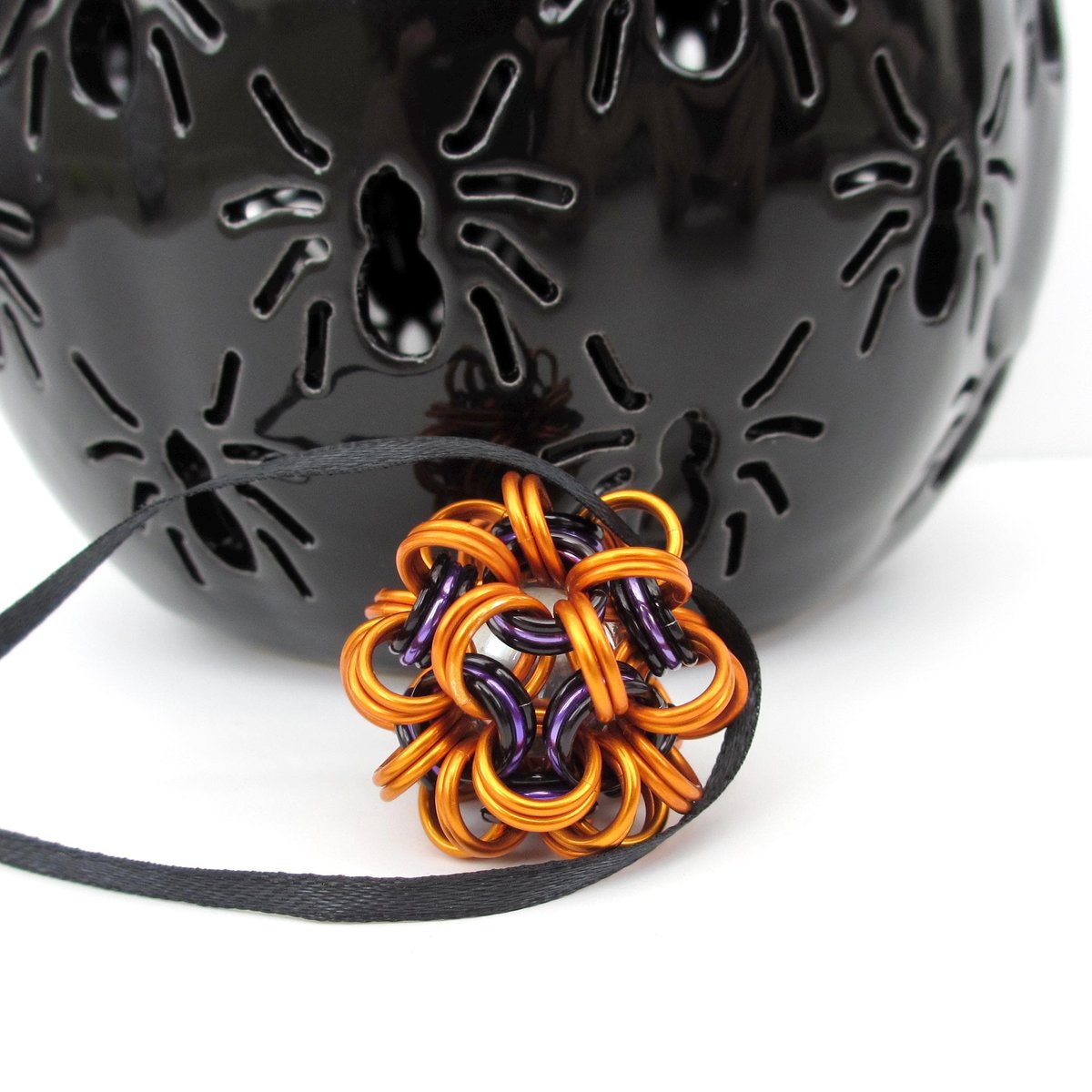 Handmade chainmail mini Halloween ornament, pumpkin orange, black, and purple seasonal dodecahedron decoration