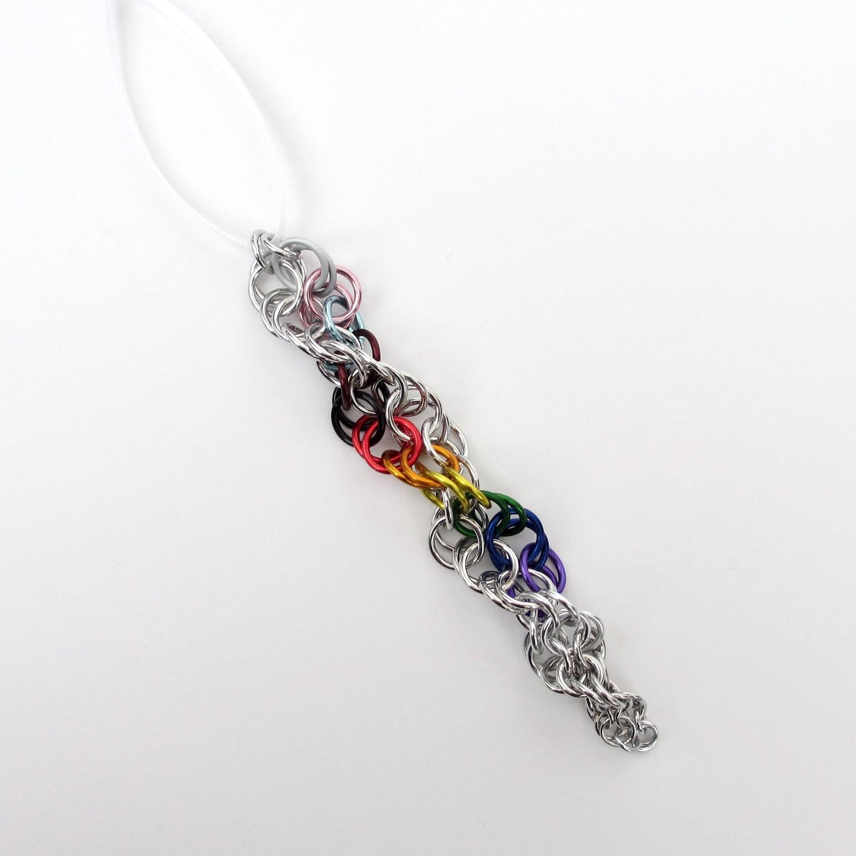 Progress pride flag icicle ornament, handmade chainmail spiral in rainbow, trans, and BIPOC colors