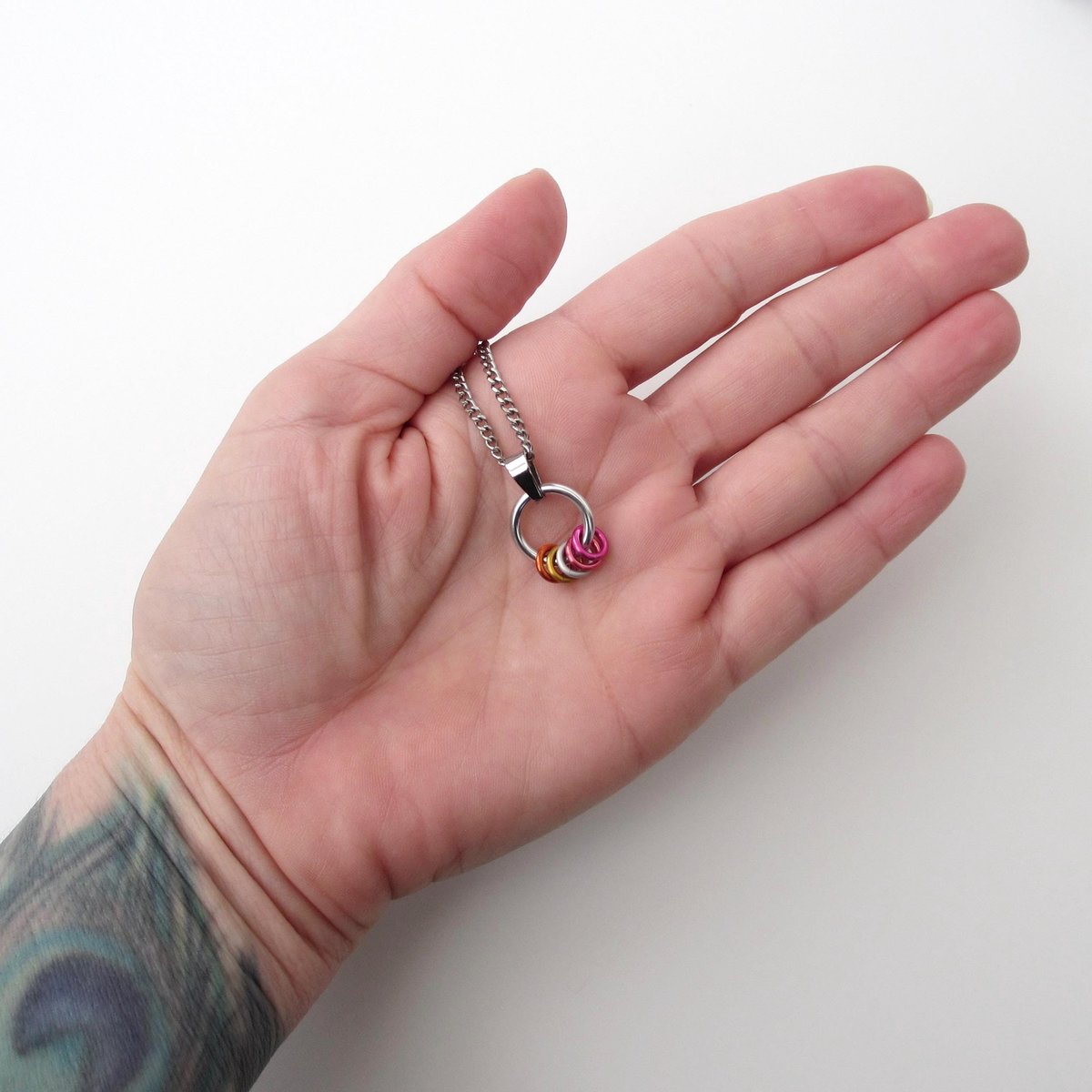 Minimalist Lesbian Pride Pendant with Floating Rings in Sunset Flag Colors - Handmade LGBTQ Jewelry