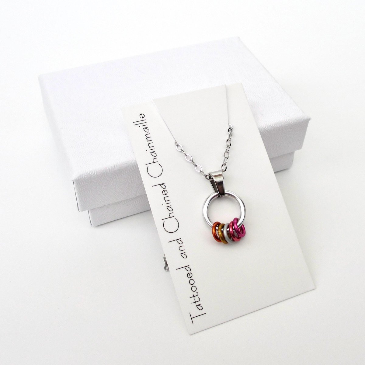 Minimalist Lesbian Pride Pendant with Floating Rings in Sunset Flag Colors - Handmade LGBTQ Jewelry