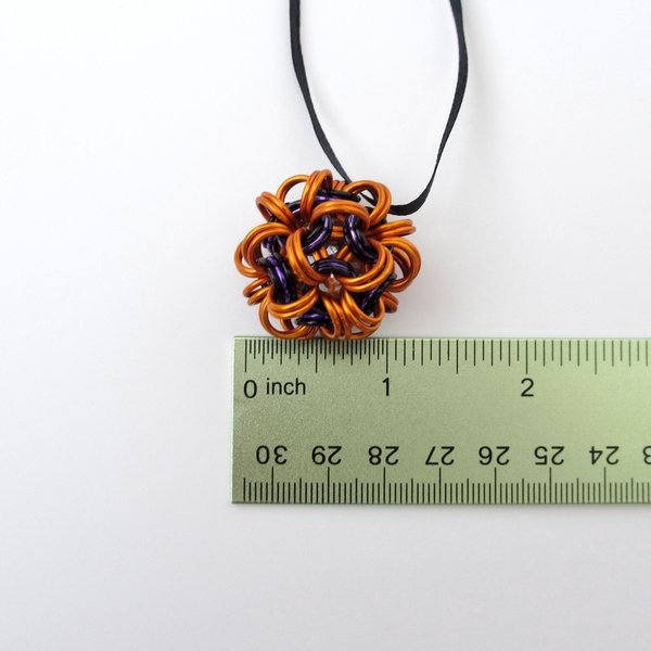 Handmade chainmail mini Halloween ornament, pumpkin orange, black, and purple seasonal dodecahedron decoration
