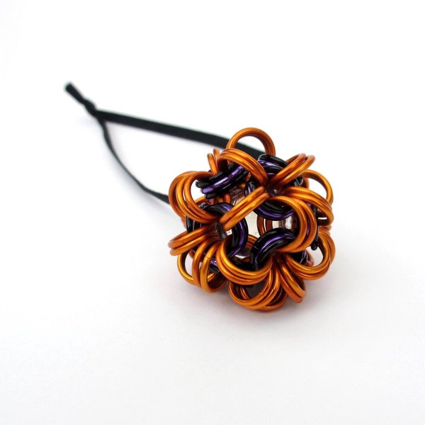Handmade chainmail mini Halloween ornament, pumpkin orange, black, and purple seasonal dodecahedron decoration