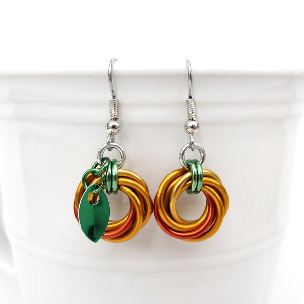 Small pumpkin earrings, fall jewelry with green leaf accent, handmade chainmail swirled knot -autumn, Halloween and Thanksgiving accessories