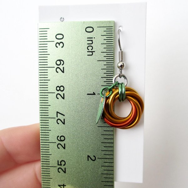 Small pumpkin earrings, fall jewelry with green leaf accent, handmade chainmail swirled knot -autumn, Halloween and Thanksgiving accessories